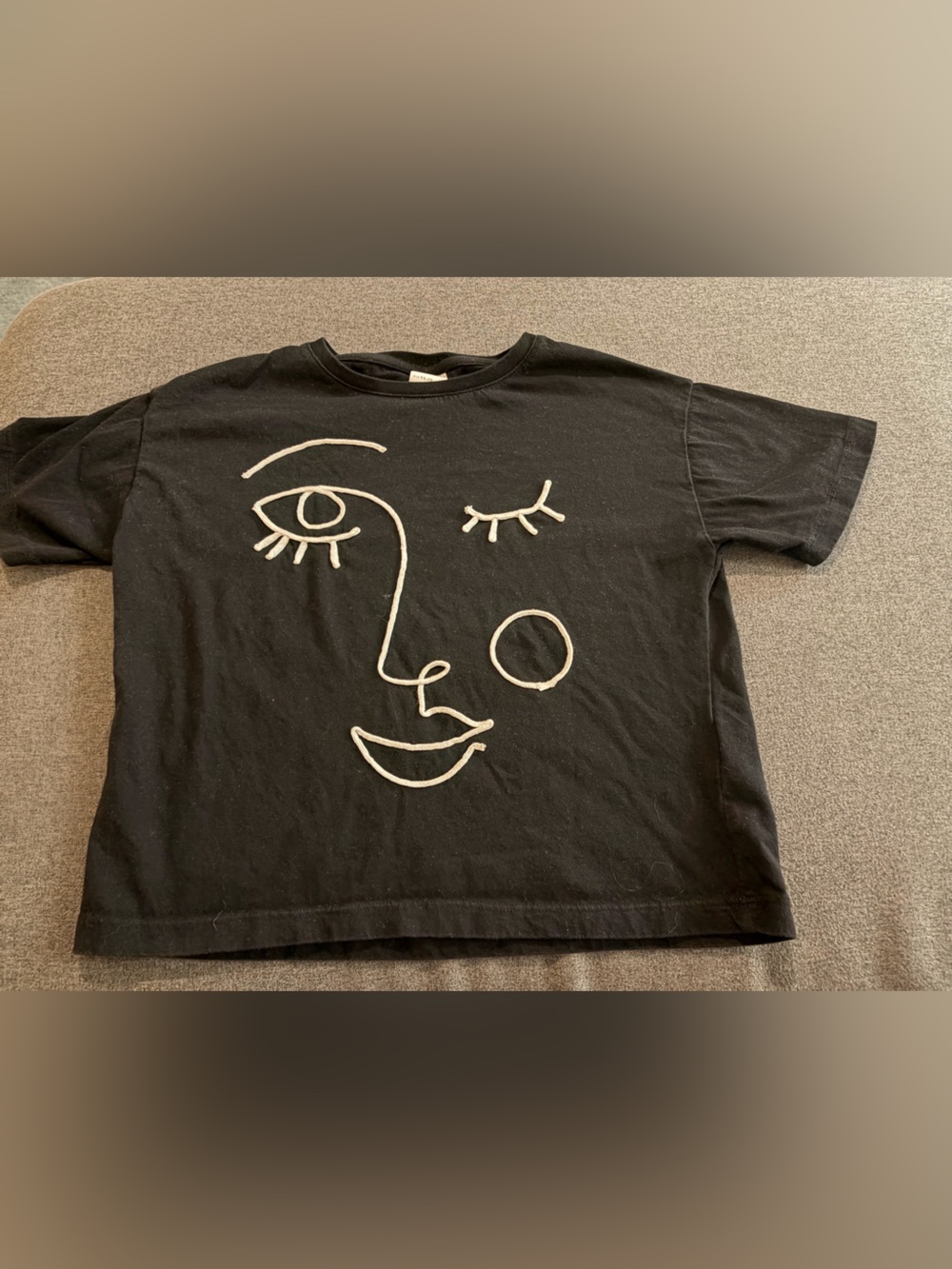 Zara Black Tee with Cream Line Face Graphic